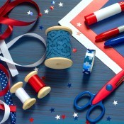 A collection of craft supplies for making patriotic decorations.